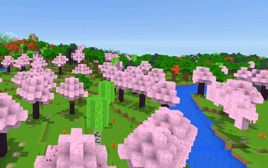 A river winding through a cherry blossom forest